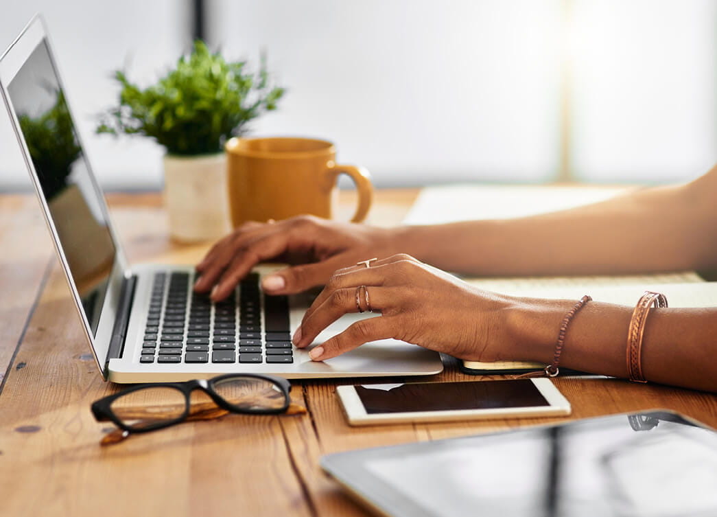 Master of Philosophy | Hands with jewellery on laptop | Torrens University | Large